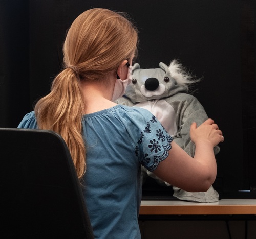 Teaching Safe Social Touch Interactions Using a Robot Koala